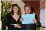 Stephen Wyatt collecting the Tinniswood Award from  Pauline McLynn